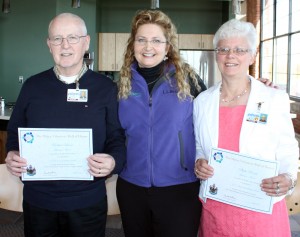 Richard Lavoie and Phyllis Benoit of Lewiston are presented with the Maine Governor's Award for Service and Volunteerism by Mary Dempsey.
