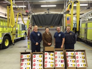 Sonia Taylor of the Jesus Party (2nd from l.), with Lewiston Firefighters Association members (from l.) Jon Demers, Todd LeClerc, and Alan Hodgkins.